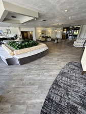 Lobby with a textured ceiling and recessed lighting