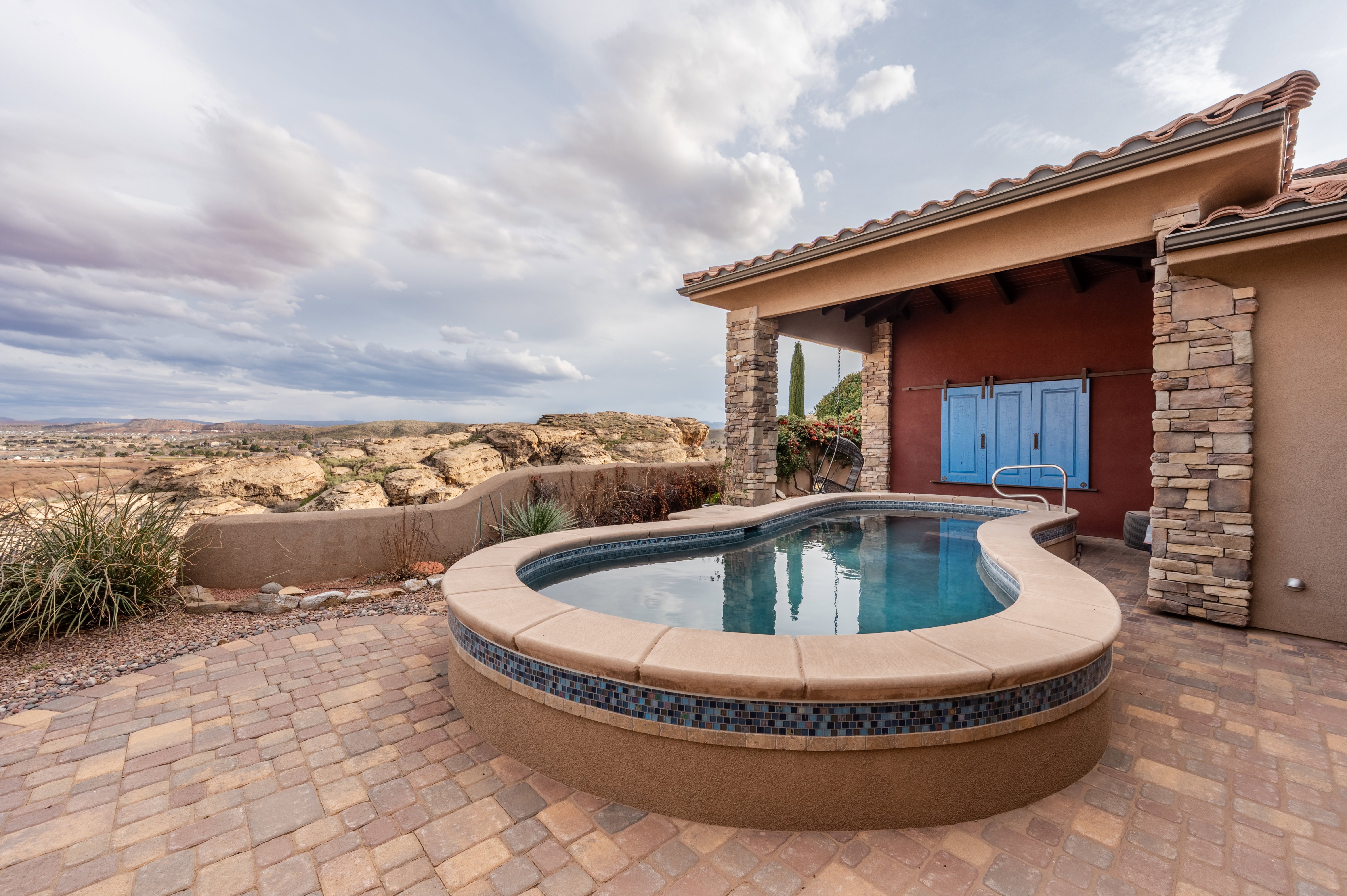 View of swimming pool featuring patio surround