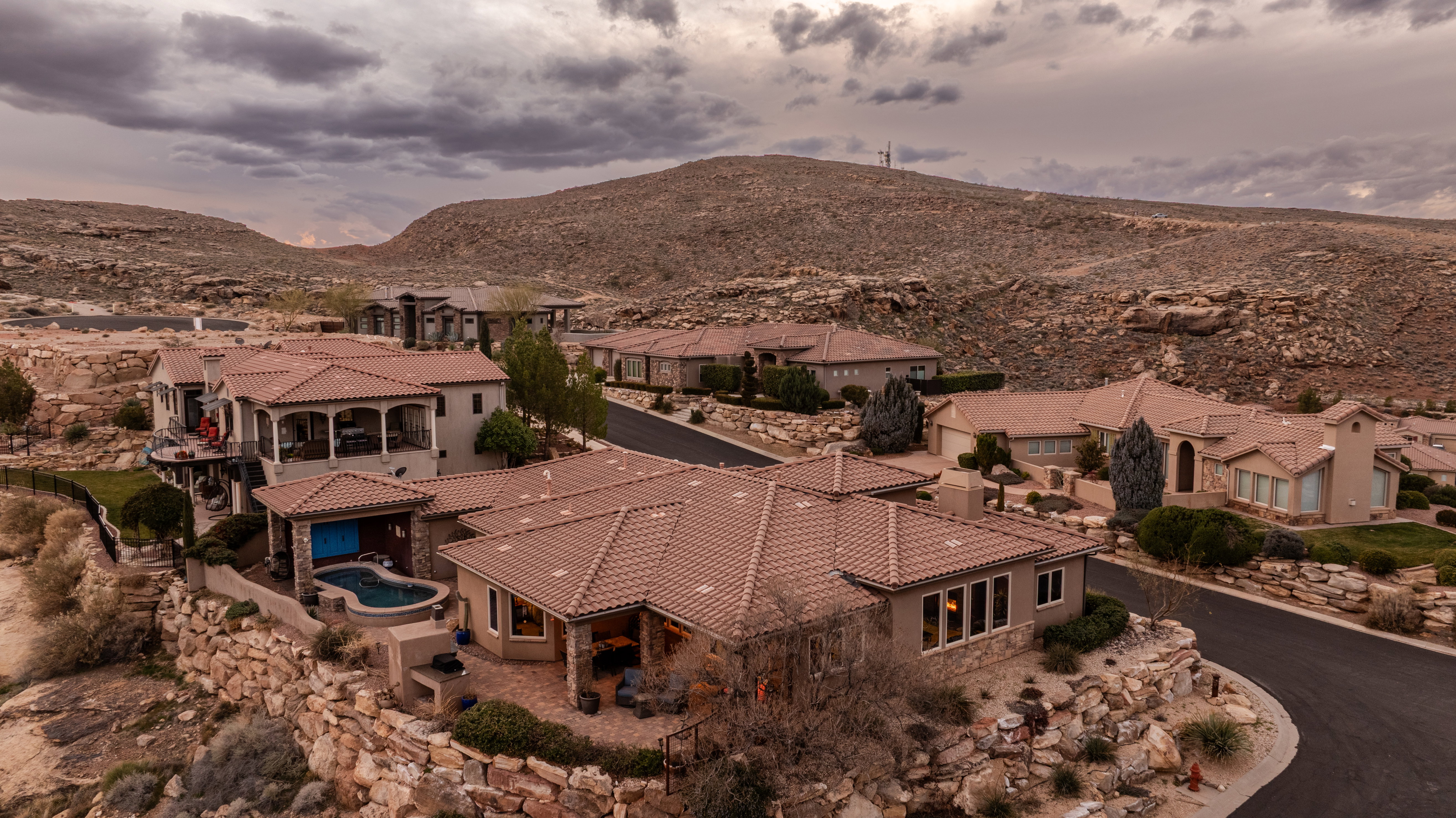 Aerial perspective of suburban area featuring a mountain backdrop