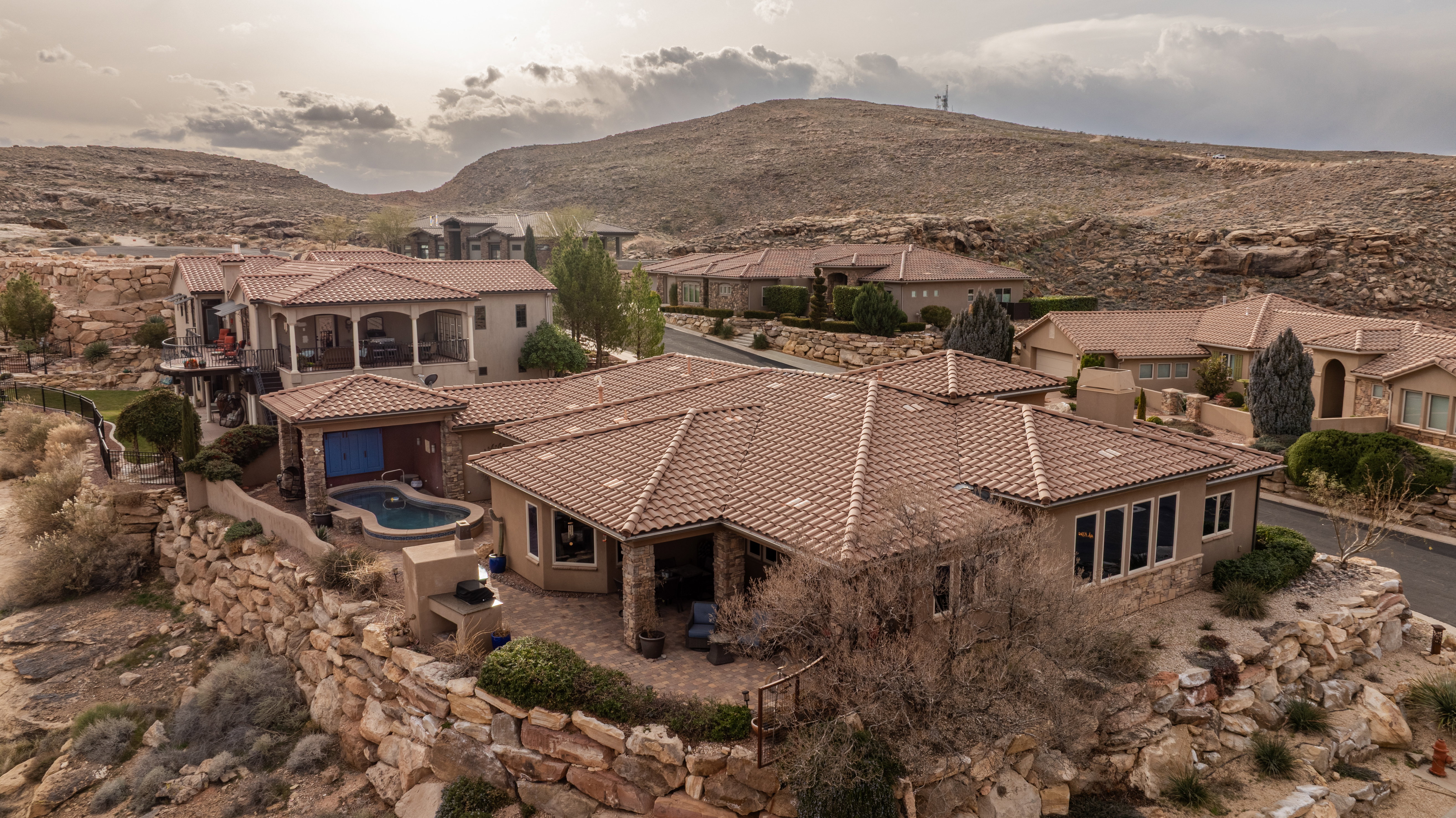 Aerial view of residential area featuring a mountain backdrop