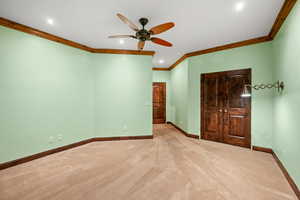 Unfurnished bedroom with carpet floors, crown molding, recessed lighting, a closet, and ceiling fan