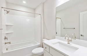 Bathroom with vanity, shower / washtub combination, and recessed lighting