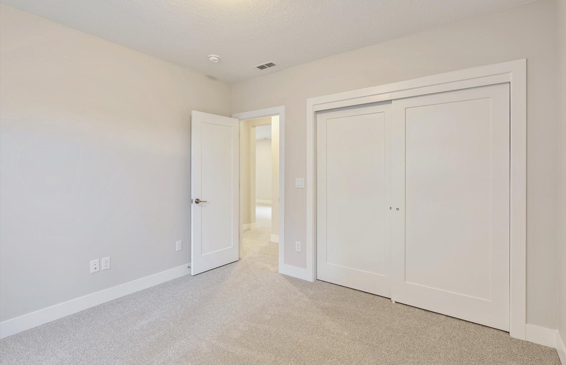 Unfurnished bedroom featuring carpet and a closet