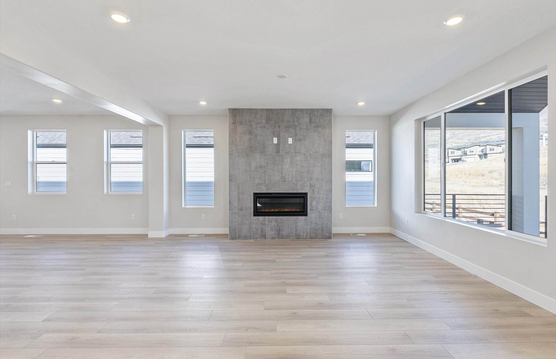 Gathering Room with a fireplace and light wood-type flooring