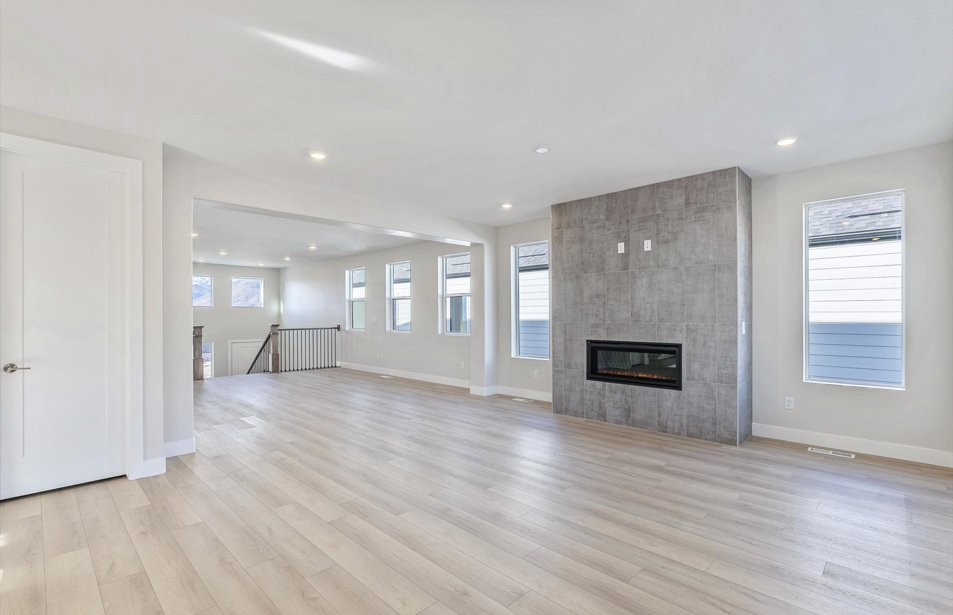 Flex room and Gathering Room featuring a tile fireplace