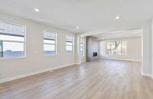 Flex room and Gathering Room featuring a tile fireplace