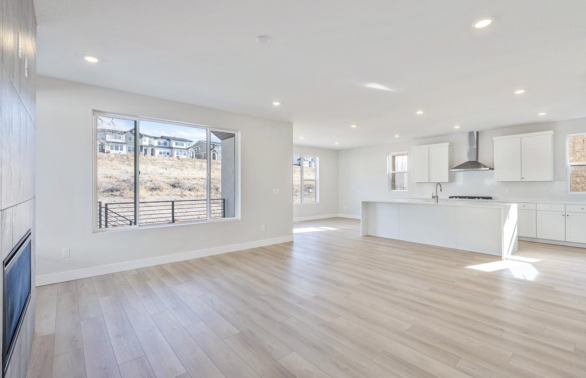 Unfurnished living room with light wood-style flooring and recessed lighting