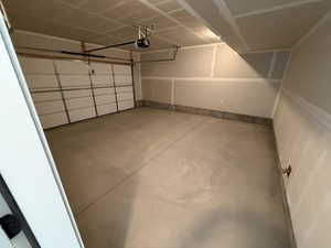 Garage featuring a garage door opener