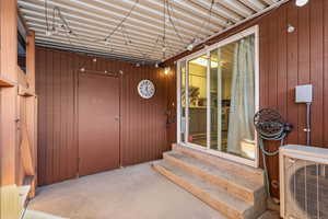 Entrance to property featuring a patio