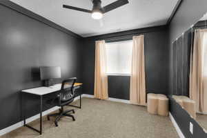 Office with light carpet, a ceiling fan, and a textured ceiling