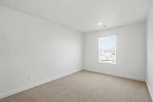 Empty room with baseboards and carpet floors
