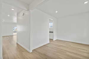 Spare room featuring light wood-type flooring and recessed lighting