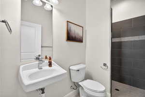 Casita bath featuring toilet and a roll/walk in shower