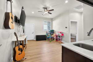 Casita private entrance featuring light wood-type flooring, recessed lighting, and ceiling fan