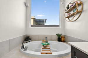 Primary Ensuite bathroom with a garden tub and vanity