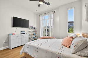 Bedroom featuring wood finished floors and ceiling fan
