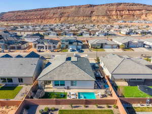 Drone / aerial view of backyard, pool area and mountains
