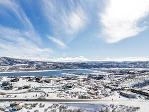 Snowy aerial view featuring a mountain view