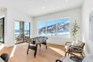 Game room featuring light wood finished floors and recessed lighting