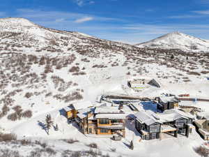 Snowy aerial view featuring a mountain view