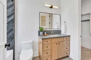Full bath with vanity and toilet