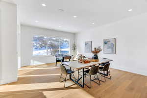 Dining space featuring light wood-style flooring and recessed lighting
