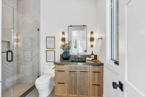 Full bath featuring vanity and a stall shower