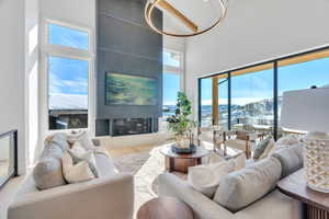 Living area with a high ceiling and wood finished floors