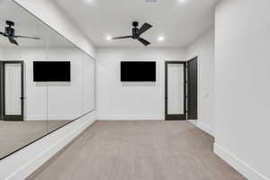 Unfurnished room with ceiling fan, light wood-style flooring, and recessed lighting