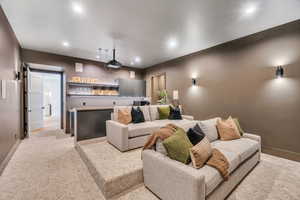 Cinema room with recessed lighting and baseboards