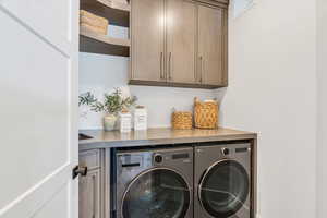 Laundry room with cabinet space and washer and dryer