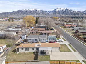 Aerial view of residential area featuring a mountainous background