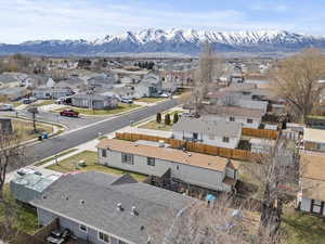 Aerial perspective of suburban area with a mountain backdrop