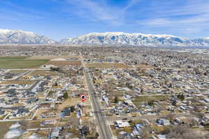 Aerial view of residential area featuring a mountain backdrop