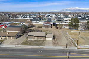 Aerial view of residential area featuring a mountainous background