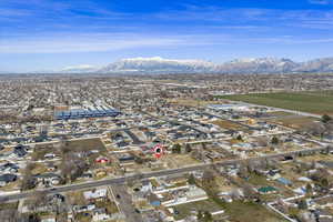 Aerial view of residential area featuring a mountain backdrop