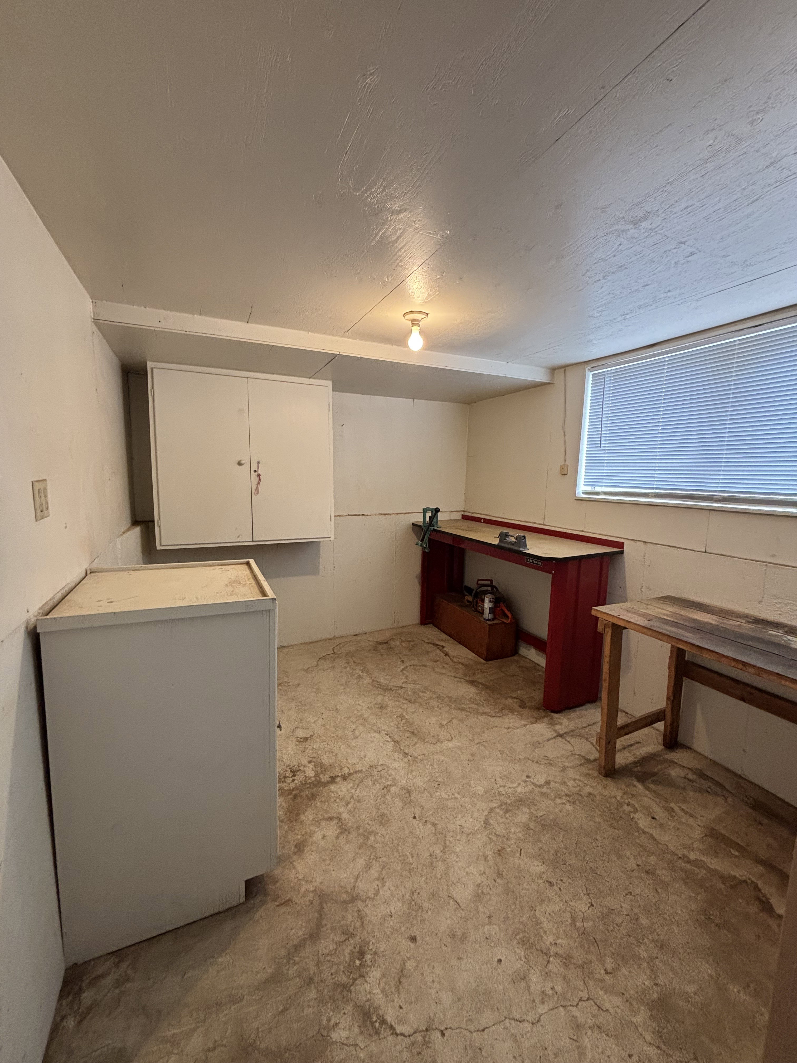 Below grade area with a textured ceiling
