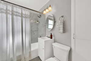 Updated main floor full bathroom. featuring vanity and shower / bath combo