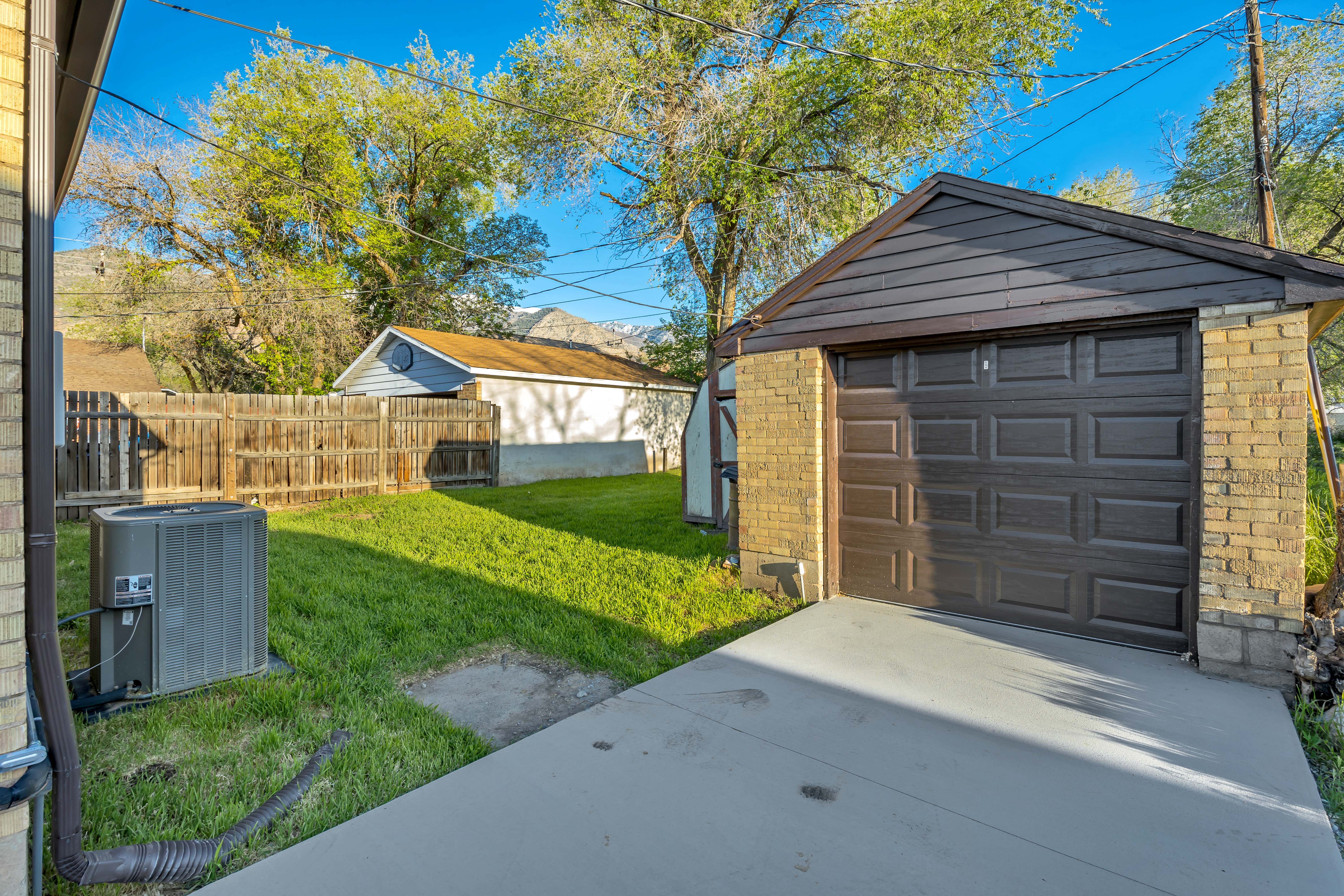 Detached garage with concrete driveway