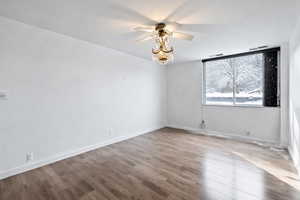 Empty room featuring wood finished floors and ceiling fan