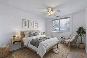 Bedroom with wood finished floors and a ceiling fan