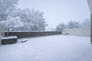 View of yard layered in snow