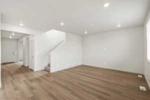 Unfurnished living room with recessed lighting and light wood-style flooring