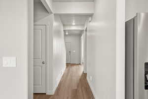 **DISCLAIMER** Interior package & colors may vary. Corridor with wood finished floors and baseboards