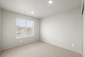 **DISCLAIMER** Interior package & colors may vary. Unfurnished room with light carpet and recessed lighting
