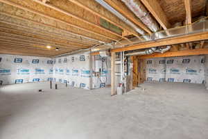 Unfinished basement featuring water heater and heating unit