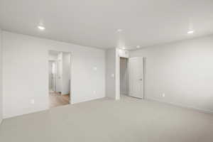 **DISLCAIMER** Interior package & colors may vary. Unfurnished bedroom featuring light carpet and recessed lighting