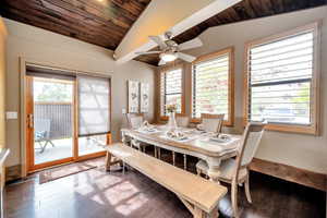 Dining area featuring a vaulted wood ceiling, a ceiling fan, and hardwood / wood-style flooring