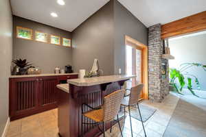 Bar area featuring light tile patterned flooring