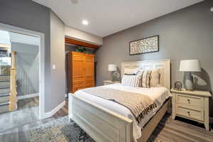 Bedroom with dark wood-type flooring and recessed lighting